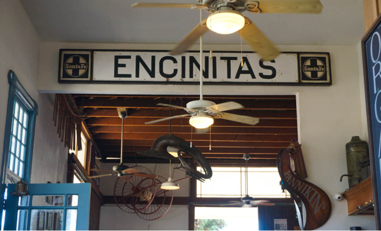 The iconic Encinitas sign at Pannikin, welcoming visitors to explore the town's diverse dining scene.